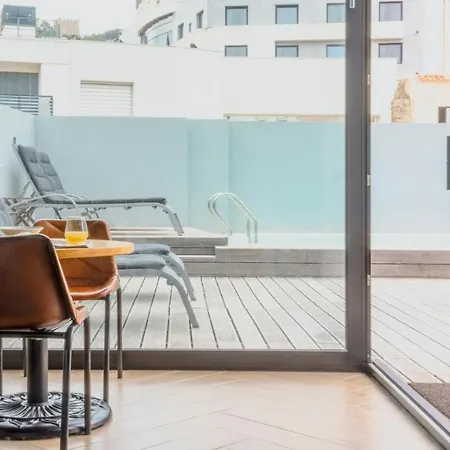 Plum Guide - The Poolside Collage Apartment *